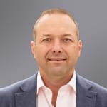 Adam Comora Headshot